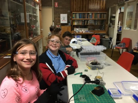 Emilka, Jaimie and Matthew soldering workshop