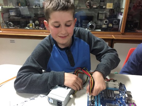Matthew deconstructing a PC for computer components